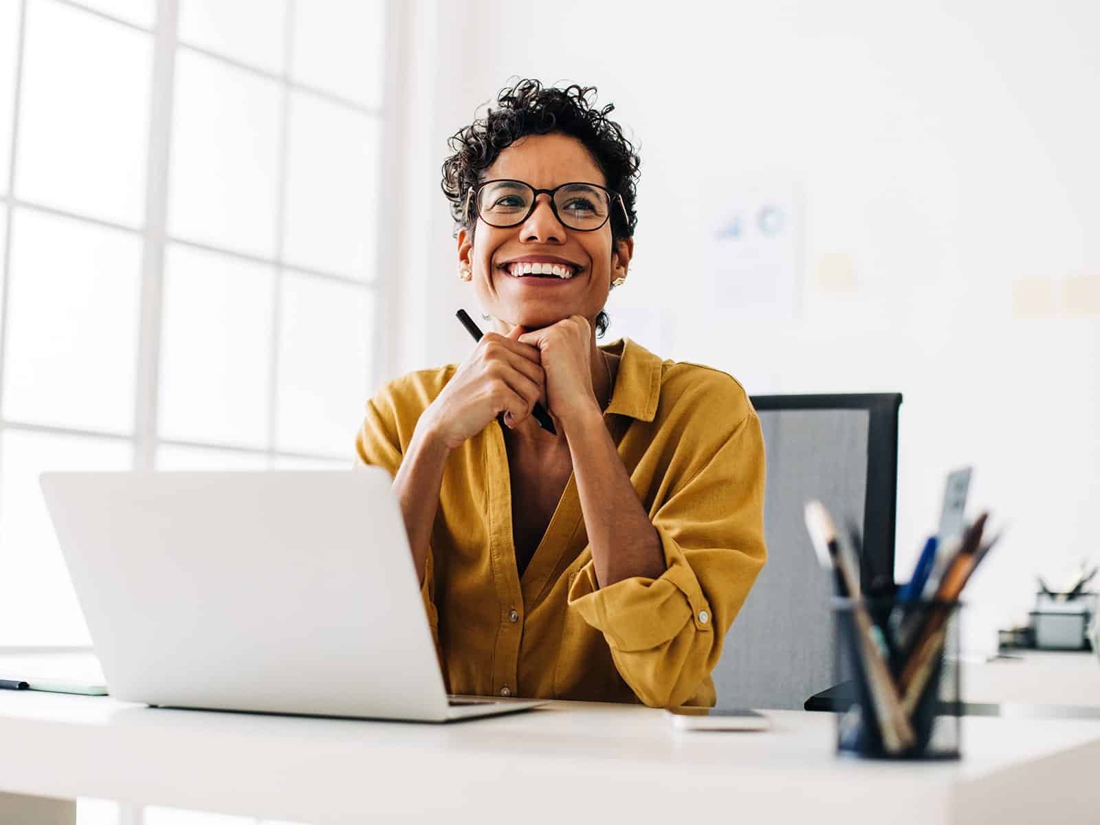 Woman smiling at desk