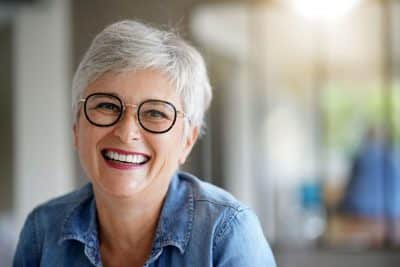 senior adult woman smiling with teeth