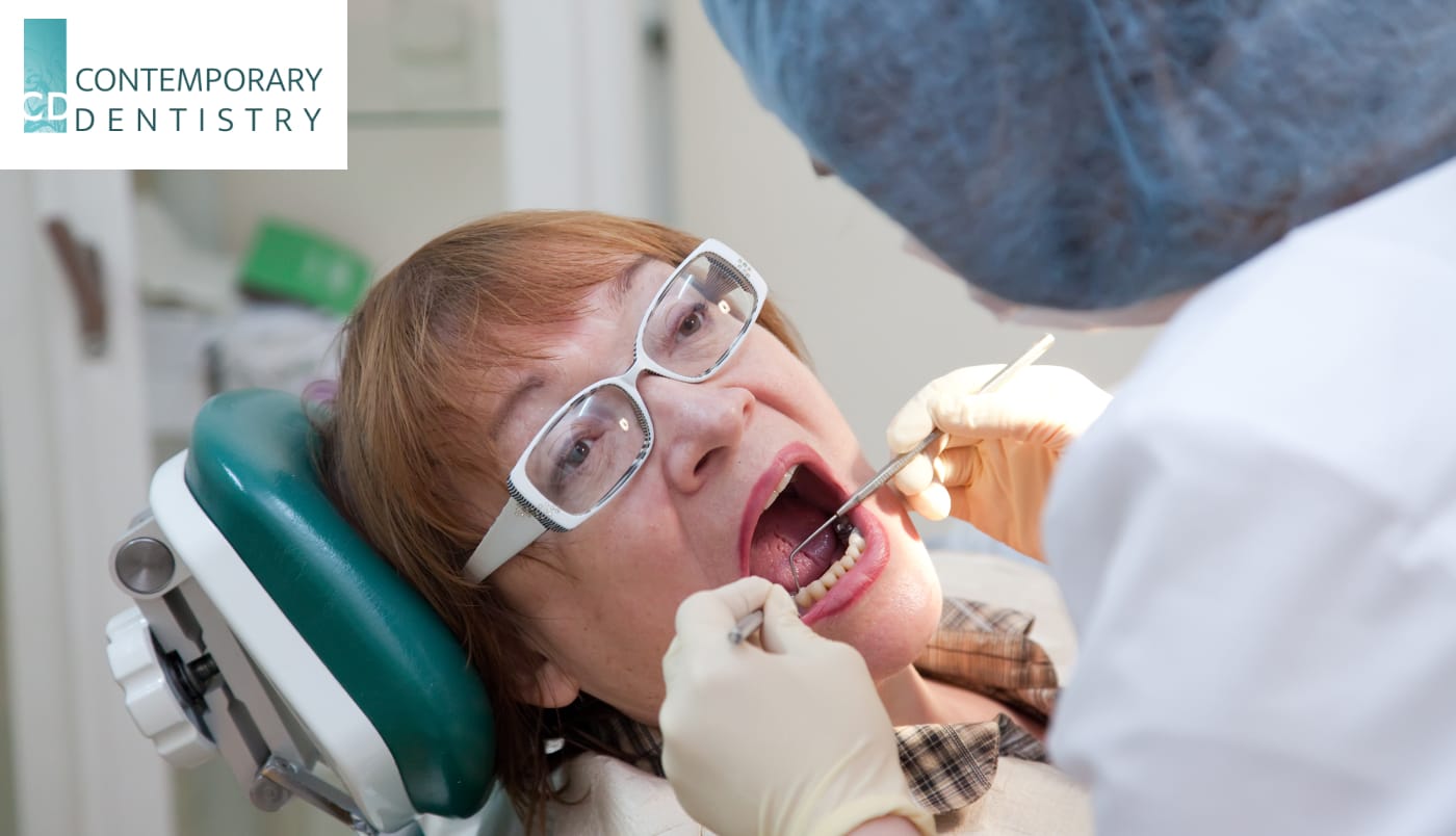 dental check emergency Dentist examining a patient during an emergency dental visit