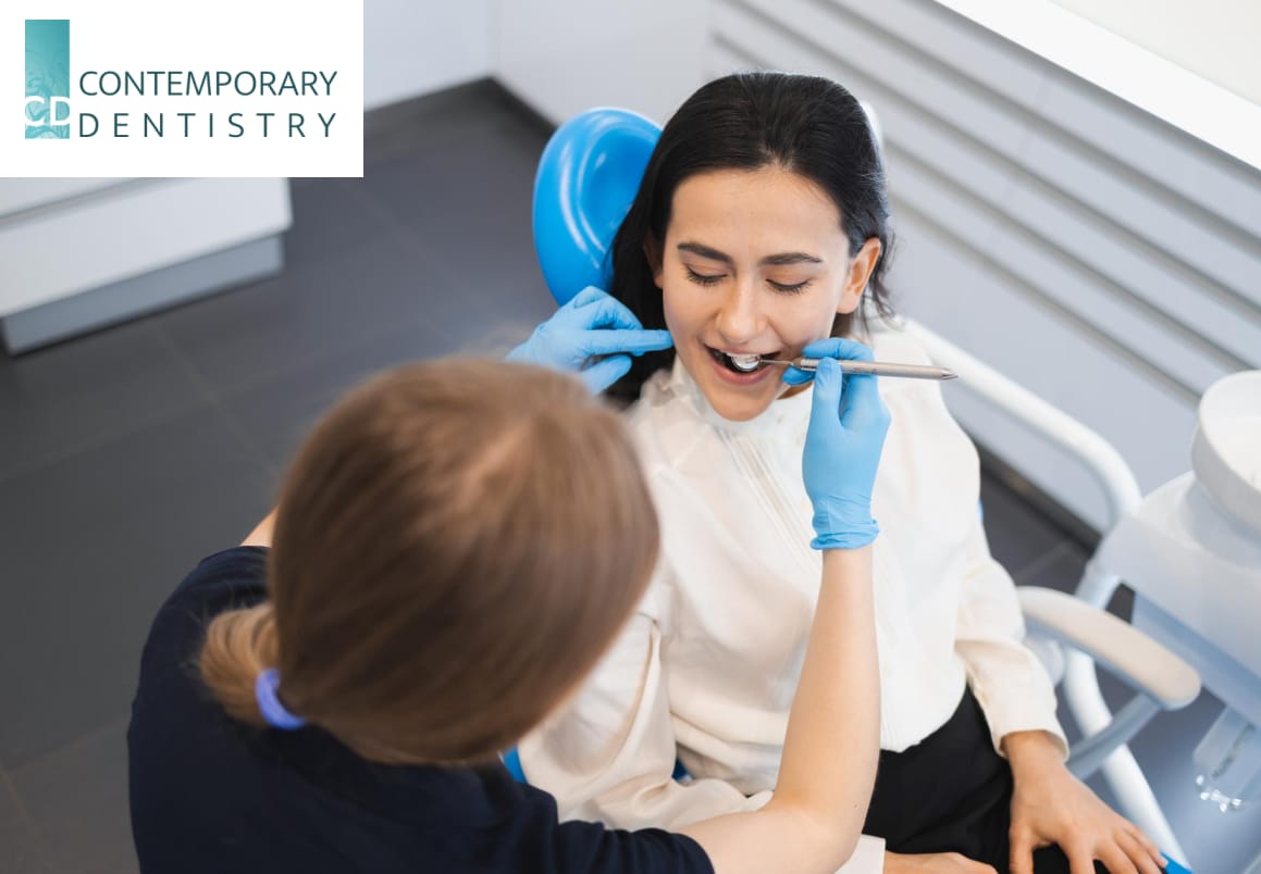 patient dentist Woman sitting in dental chair at medical center while professional doctor checks her teeth