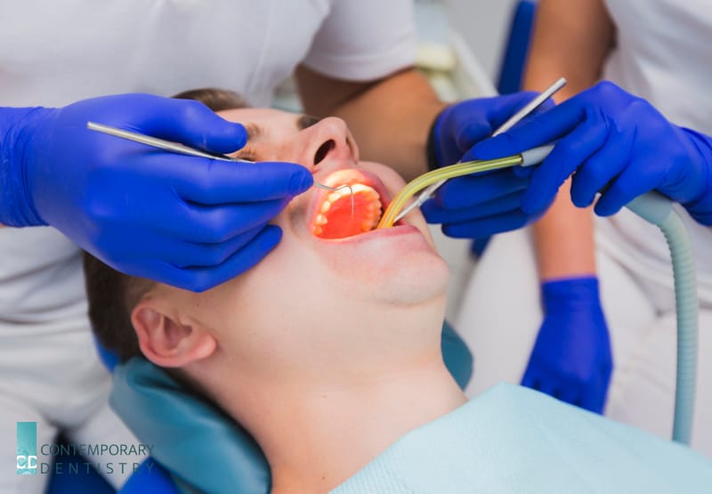 clinic whitening Dentist performing a dental exam using professional instruments