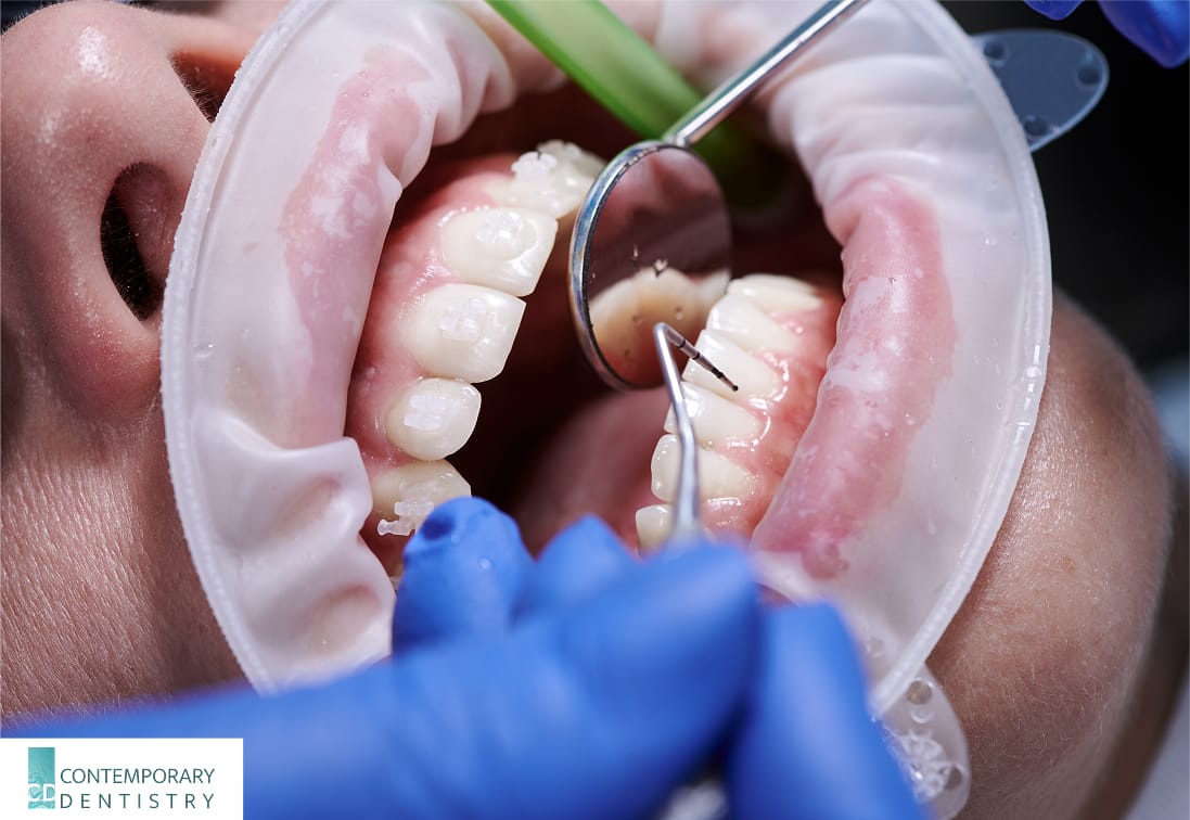 Dentist performing an emergency dental exam on a patient